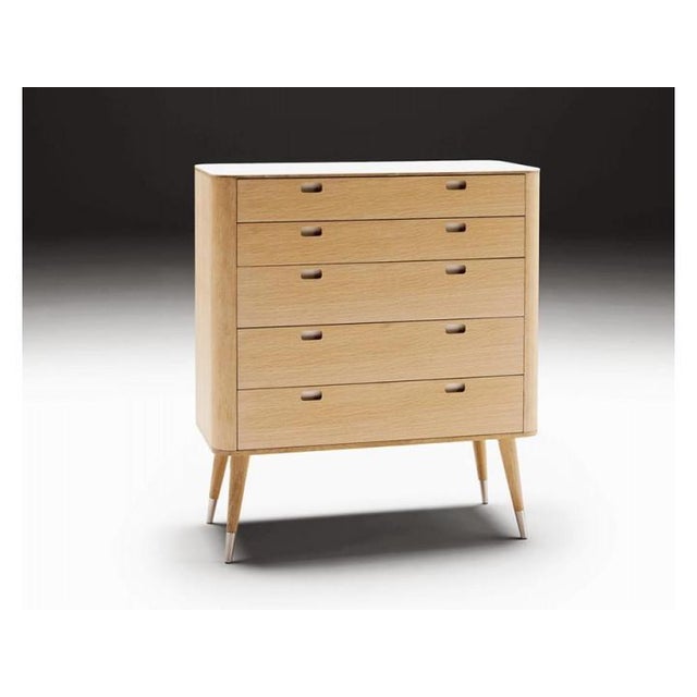 Chest of drawers with 5 wooden drawers, handles and top in white corian (color"" glacier white ""). The feet are fitted...