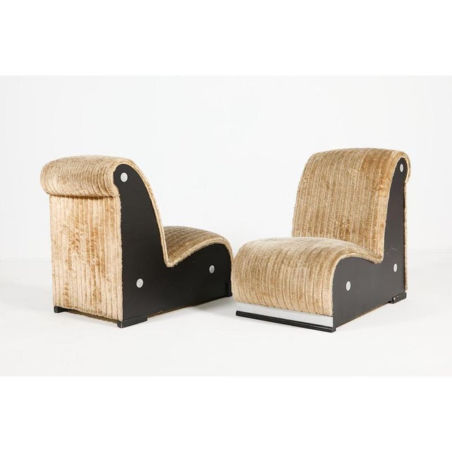 Sculptural easy chairs, produced in 1970's Italy. It features wooden frame upholstered in beige plush fabric. Condition...