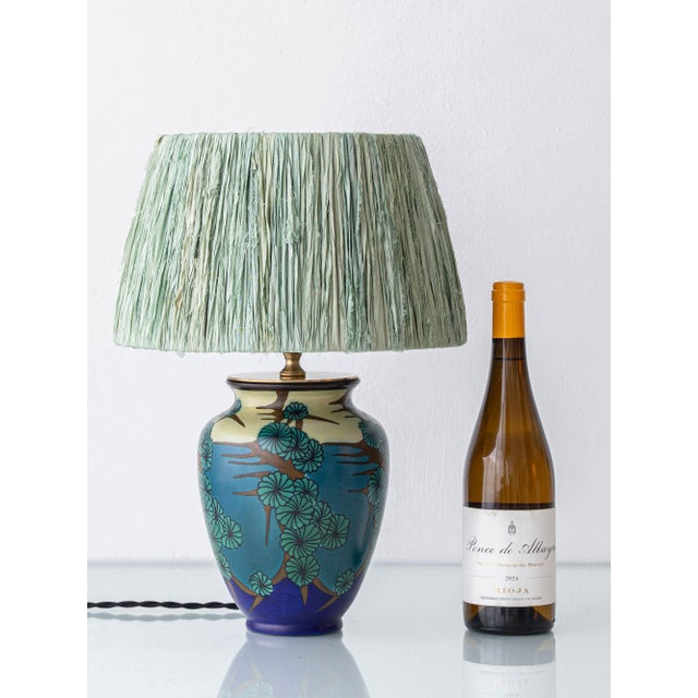 An art deco dutch ceramic table lamp made from a 1928 pzh gouda yozea vase, featuring japonisme floral decoration in...