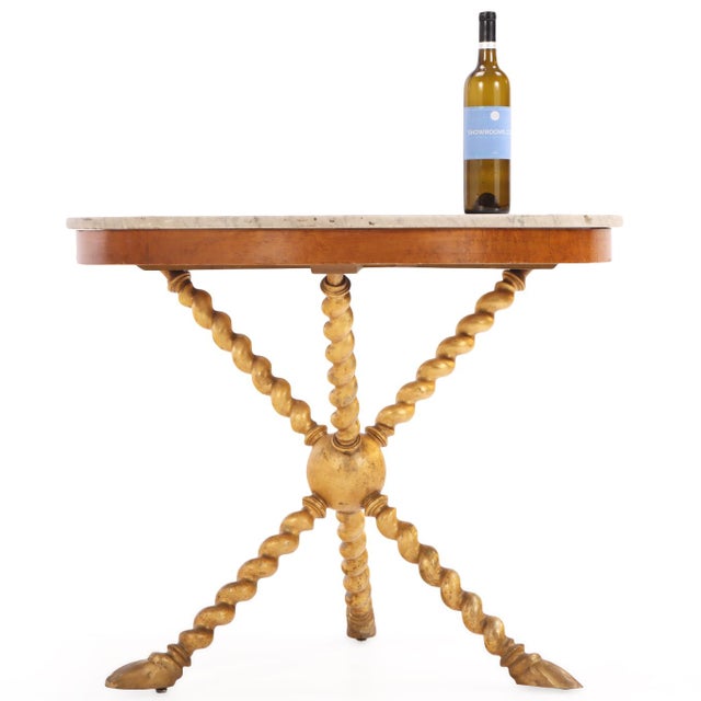 Italian mid-century center table assembled with antique and later parts, featuring a round white marble top supported by...