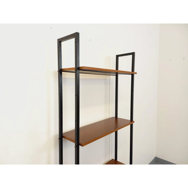 Vintage Scandinavian-style bookcase from the 1960s, Italian design, made of teak and black metal, with 4 open shelves. Can...
