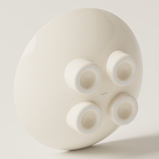 A sculptural ceramic bowl with a super glossy finish, ideal for fruit, dried flowers, or as a standalone art object. Part...