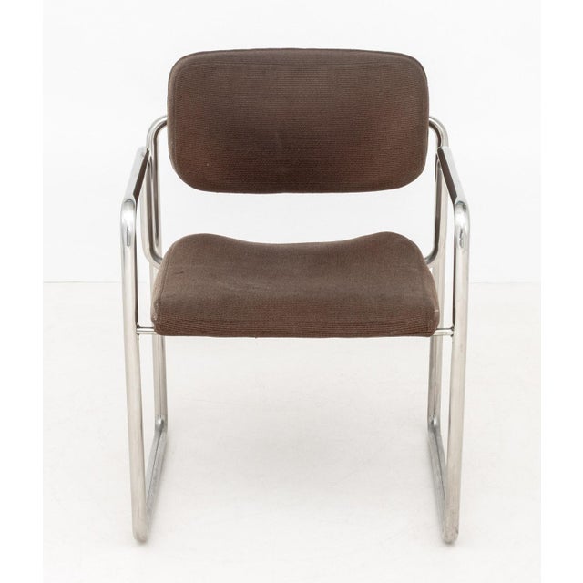 Bauhaus Brown Upholstered Chrome Arm Chair. 30.5" H x 22" W x 21" D; seat: 17.5" H; arms: 24.25" H. Provenance: From a...
