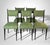Elegant set of six ebonized wood chairs, featuring seats and backrests upholstered in a cotton and polyester fabric. The...