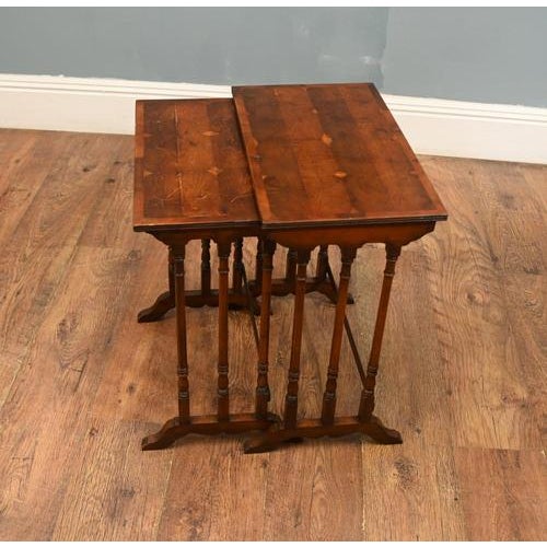 A charming pair of Edwardian-style mahogany occasional tables, elegantly proportioned and ideal for use as side or lamp...