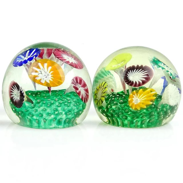 Beautiful pair of vintage Murano hand blown rainbow colors flower garden Italian art glass paperweights. Documented to the...