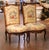 This elegant pair of antique French side chairs was crafted in walnut circa 1870 and reflects the refined curves and...