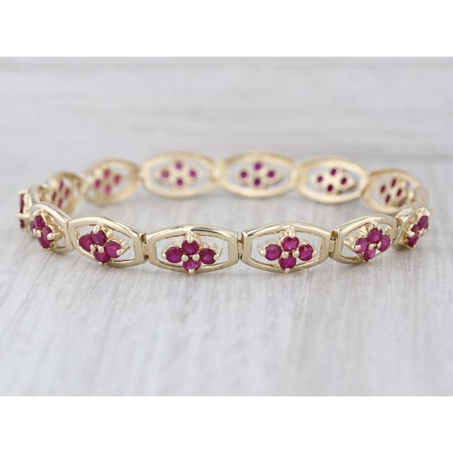 Gemstone Information: - Natural Rubies - Total Carats - 4ctw Cut - Round Color - Red Treatment - Routinely Enhanced Metal:...