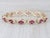 Gemstone Information: - Natural Rubies - Total Carats - 4ctw Cut - Round Color - Red Treatment - Routinely Enhanced Metal:...