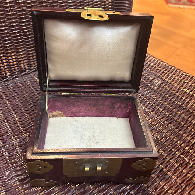 Chinese Rosewood Box with Ornate Brass and Carved Jade Insert circa 1950-1960. The inside has ivory colored silk. These...