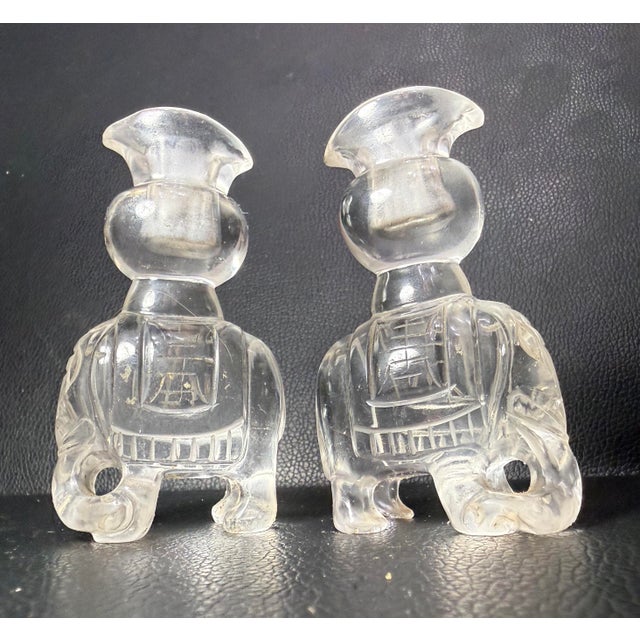 Up for sale is a lovely pair of antique hand carved Chinese figural rock crystal sculptural vases. These intricate and...