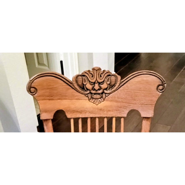 “American Victorian/Golden Oak child’s rocking chair, circa 1895–1915, solid oak with steam-bent arms, turned spindles,...