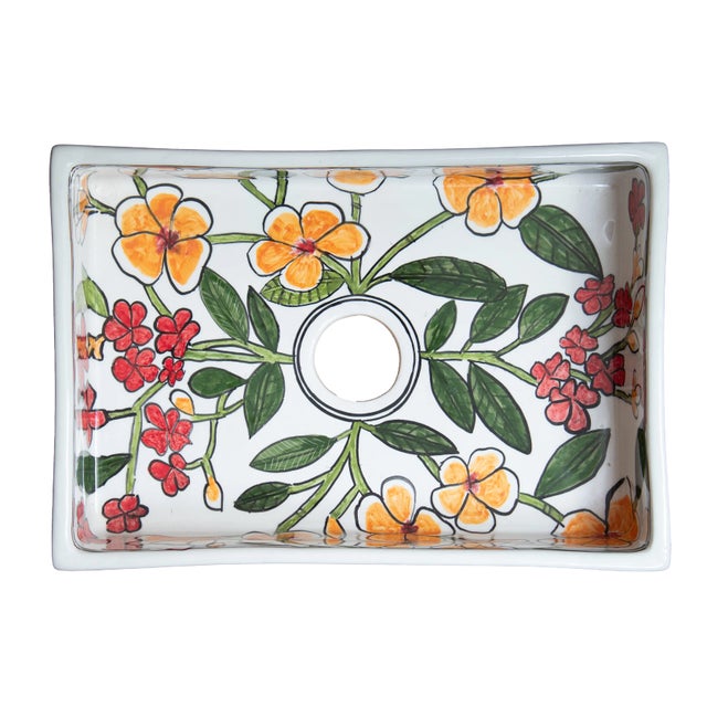 Rectangular ceramic washbasin with colored hand painted flowers for bathroom vanity. Above-counter installation suits...