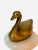Whimsical vintage brass swan on marble. The brass is tarnished to give an aged look.