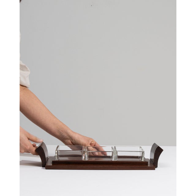 This 1930s Art Deco tray from France is finished in brown, worked in wood. Its design carries the Art Deco idiom through...