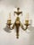 A pair of circa 1920's Caldwell gilt bronze neoclassic style sconces with two ligts