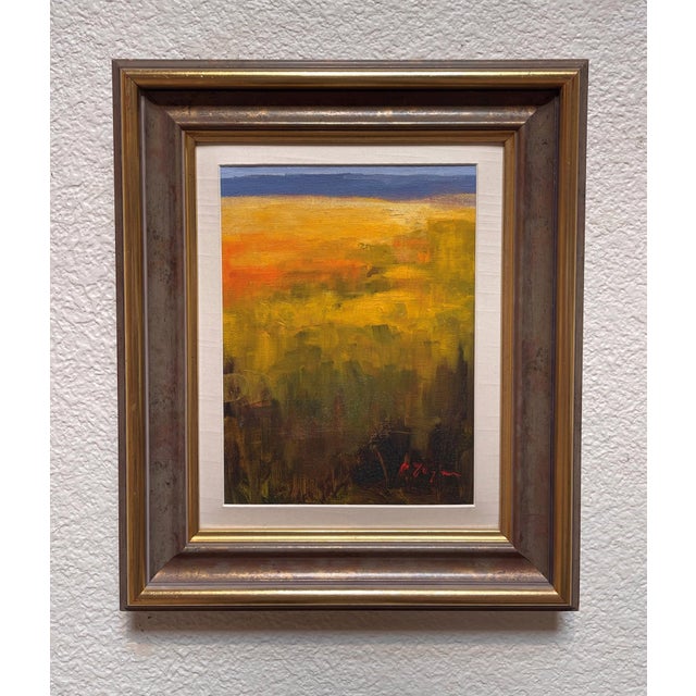 This oil on panel artwork captures a vibrant landscape bathed in warm hues of gold and orange, evoking the tranquility of...