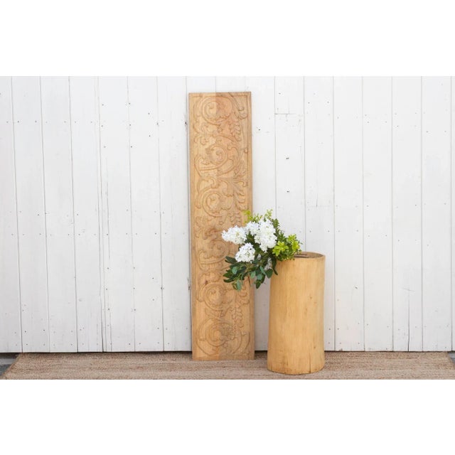 This hand carved floral and vine motif wood panel is a classic design that showcases the artisanal skills of our artisans....