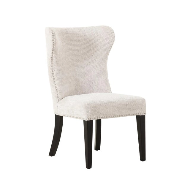 Discover the stunning Elara chair—a modern marvel that exemplifies sophistication and style. Featuring exquisite nailhead...
