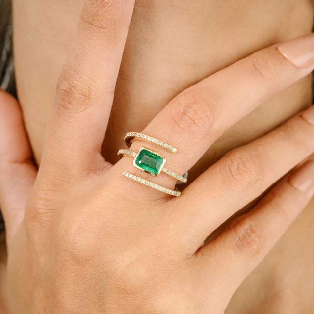 AAA Octagon Emerald Diamond Spring Spiral Ring for Her in 14K Gold featuring natural emerald of 0.92 carats and diamonds...