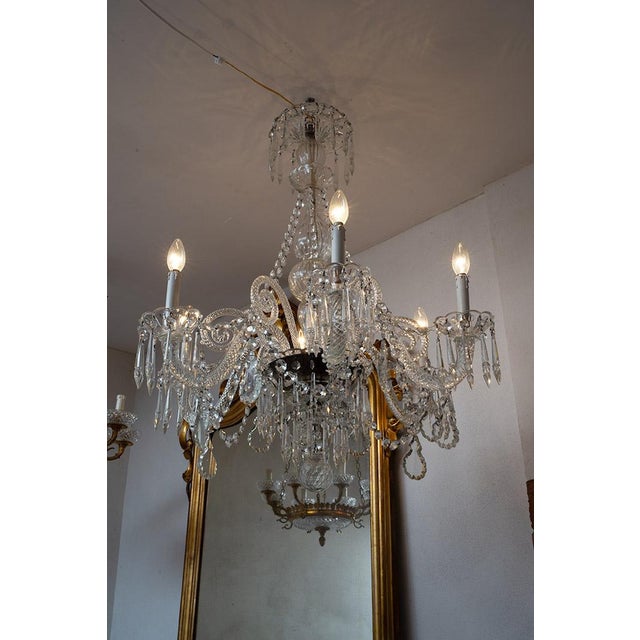 Pair of antique six-arm chandeliers made of crystal and Murano glass, dating from the early 20th century. The central...