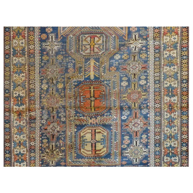 An outstanding late 19th century Persian Shirvan rug with three large medallions on an intensely woven field containing...