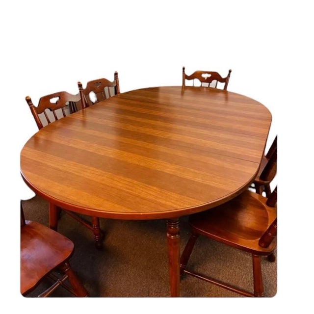 The Tell City Pattern 8163 is a vintage, Colonial-style round maple dining table 30.25' H x 48' W. Comes with (2) 11.5'w...