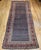 This 19th century Persian Kurdish oversized gallery rug is a striking example of tribal weaving, showcasing a...