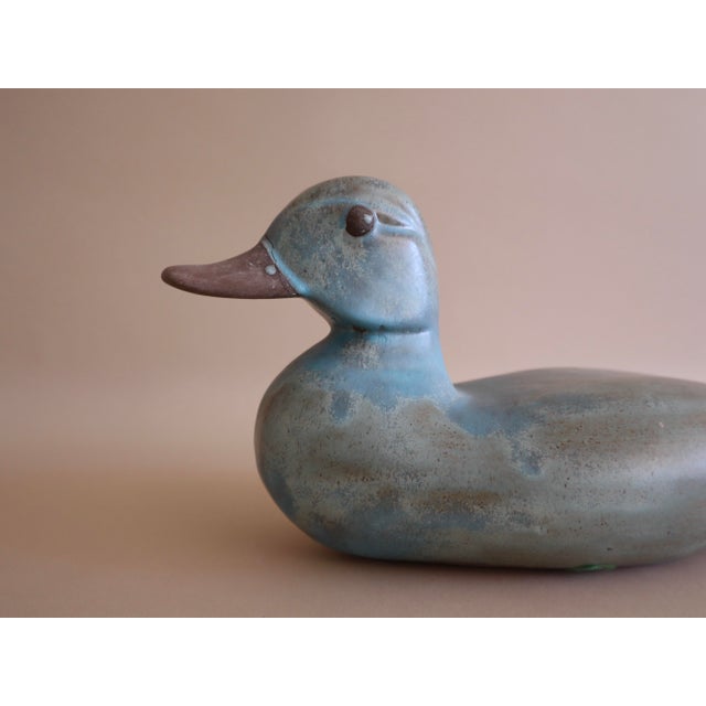 Vintage Ceramic Turquoise Duck. Hand-painted in eye-catching turquoise glaze. Smooth texture, cool tones of blue and...