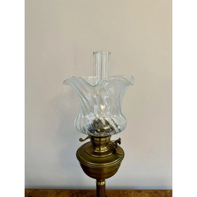 Pretty antique Edwardian quality oil lamp, having the original glass shade with a wavy shaped edge, a glass chimney, a...