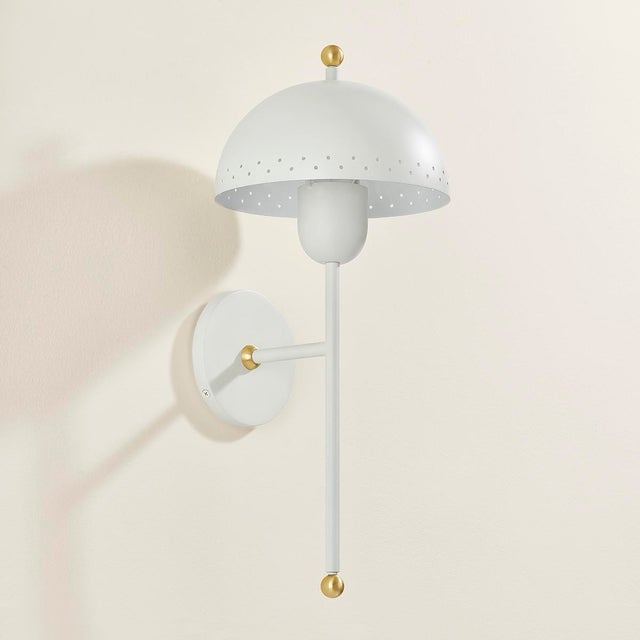 Influenced by midcentury design, Jojo features a dome-shaped shade with decorative perforations that allow light to...