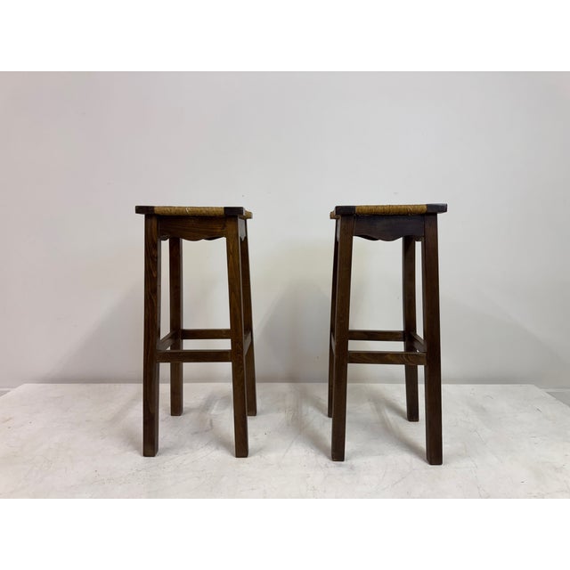 Pair of Oak and Rush Bar Stools, France, 20th Century A charming pair of French bar stools in solid oak with handwoven...
