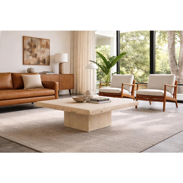 Elevate your living space with this remarkable vintage Italian modernist travertine coffee table, masterfully crafted in...