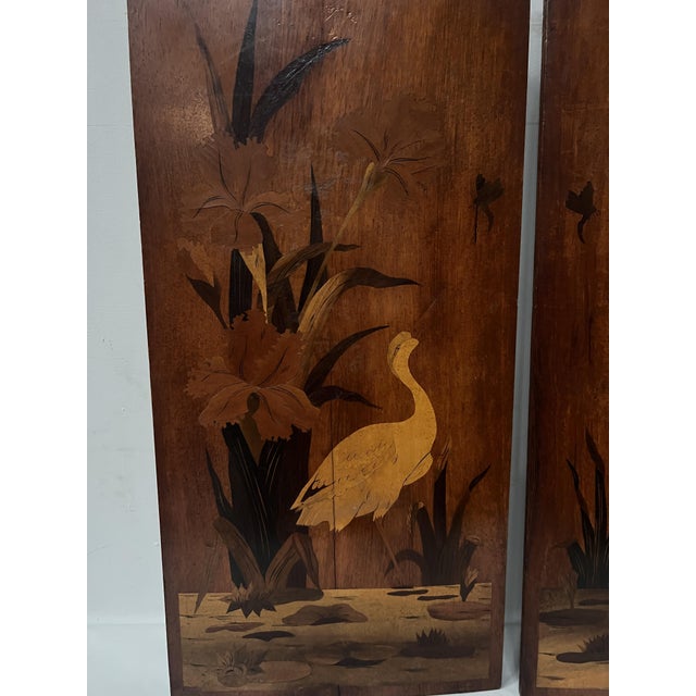 "School of Nancy" Pair of Art Nouveau marquetry panels One panel with a floral motif and the other with a pink flamingo...