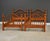 A pair of solid maple twin beds in a light cherry stain with three slats each. Made in USA. Circa 1990’s. Unmarked....