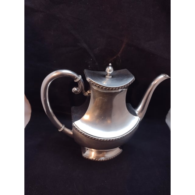 This is a 4 piece with tray German Tea Set. Marked with (crescent moon/crown WTB). Also has Eugen Marcus on the 4 serving...