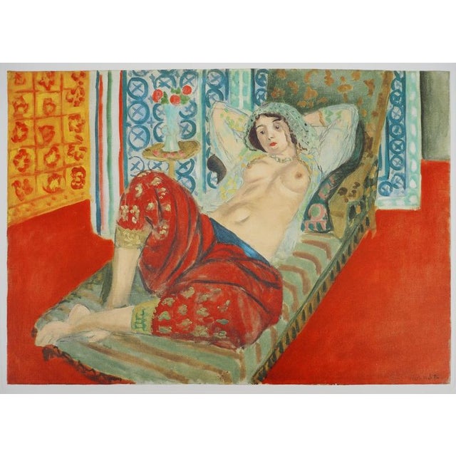 Henri MATISSE (1869-1954) Naked in red pants Color lithograph after a painting by the artist Signed in the plate On Vellum...