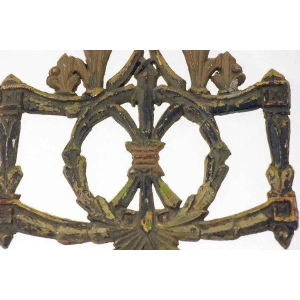 This unique applique features a crest design. The accent an be anchored to any furniture piece to add interest and detail.