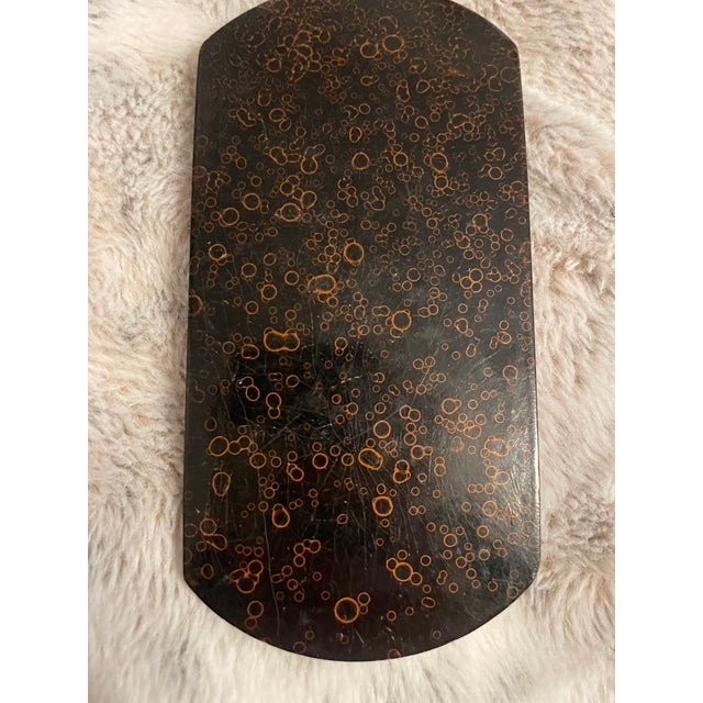 An exceptional and rare example of 18th-century craftsmanship, this mid-1700s lacquered wood box features a finely...