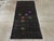 This mid-20th century Turkish Anatolian rug, measuring 2' 10" x 5' 9", presents a striking minimalist composition with a...