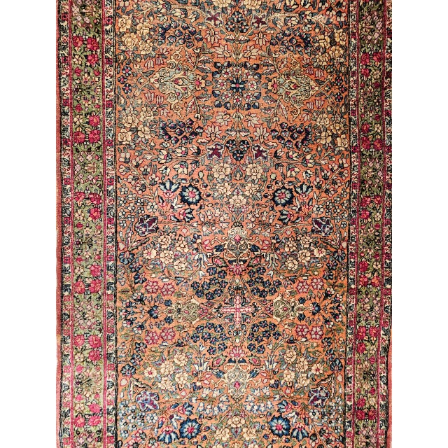 "This exquisite Lavar Kerman runner from the late 1800s is a true rarity—both in format and artistry. The allover floral...