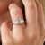 This exceptional Art Deco style engagement ring is centered by a GIA-certified Asscher cut diamond weighing an impressive...