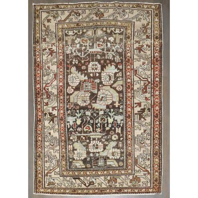 An antique Persian Malayer Rug from 2nd quarter of the 20th century with a chocolate brown ground Rug no. j4132 Size 3'4"...