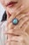 This statement ring showcases an 8.41-carat turquoise & blue sapphire set in 14k yellow gold. The turquoise measures...