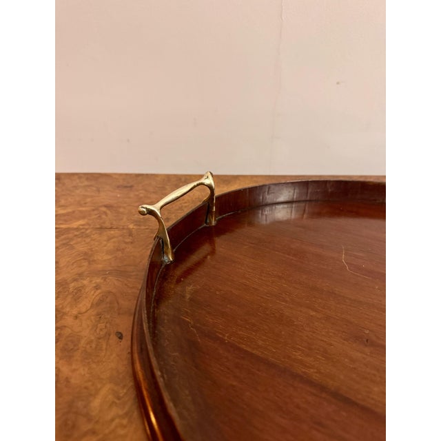 Quality antique Edwardian mahogany inlaid oval tea tray having a quality mahogany inlaid tea tray with quality inlaid...