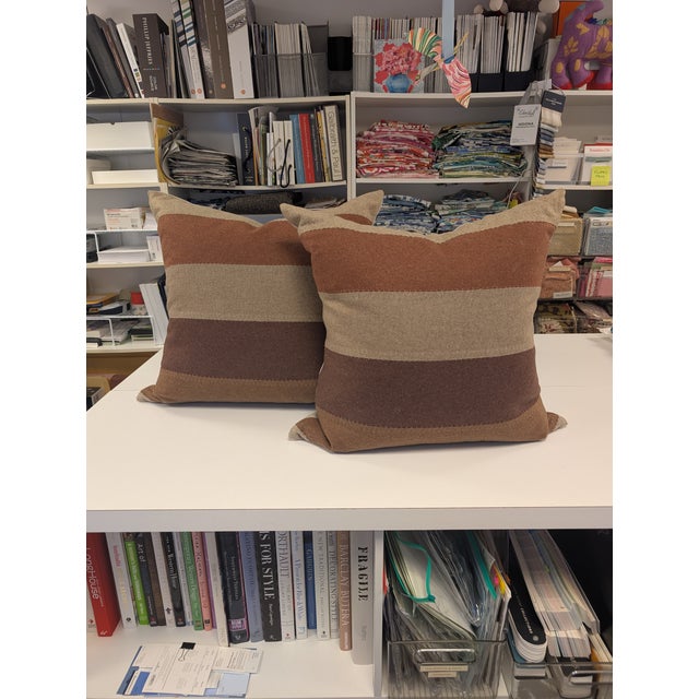 Pair of Ryan Studio 22" square pillows in four different shads of brown wool sewn together in 5 inch stripes with beige...