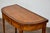 An English Neoclassical demi-lune game table from the 19th century with flip top and inlaid diamond décor. This English...