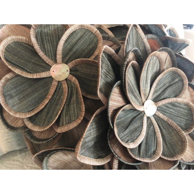 Designer dimensional pillow cover with 3-D flowers on the front. Zipper closure on the back. Measures 20” x 20”. Insert...