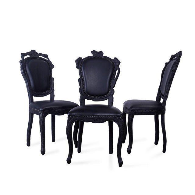 The Moooi Smoke Chairs by Maarten Baas are a bold fusion of classic form and conceptual design. Each chair begins as a...