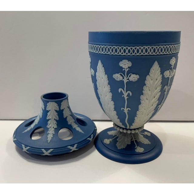Circa 1780-1820 dark blue jasper ware bough vase by Adams. Six round holes surround a larger central hole in the lid, the...